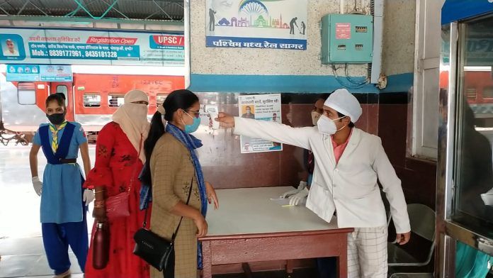 Hand sanitizers including checking of temperature of passengers at railway station